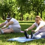 Obese couple doing exercises, starting together healthy lifestyle, support